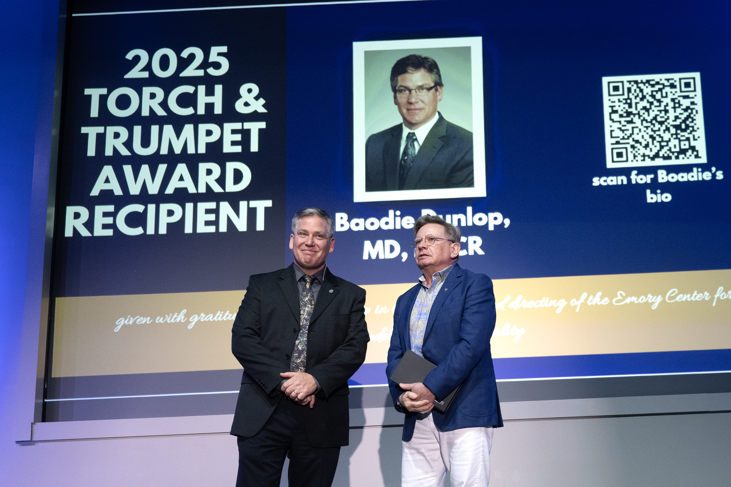 Image of Boadie Dunlop receiving Torch and Trumpet Award